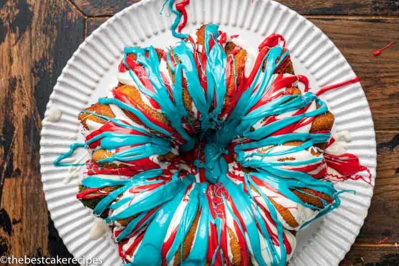 overhead view of red white and blue drizzled cake