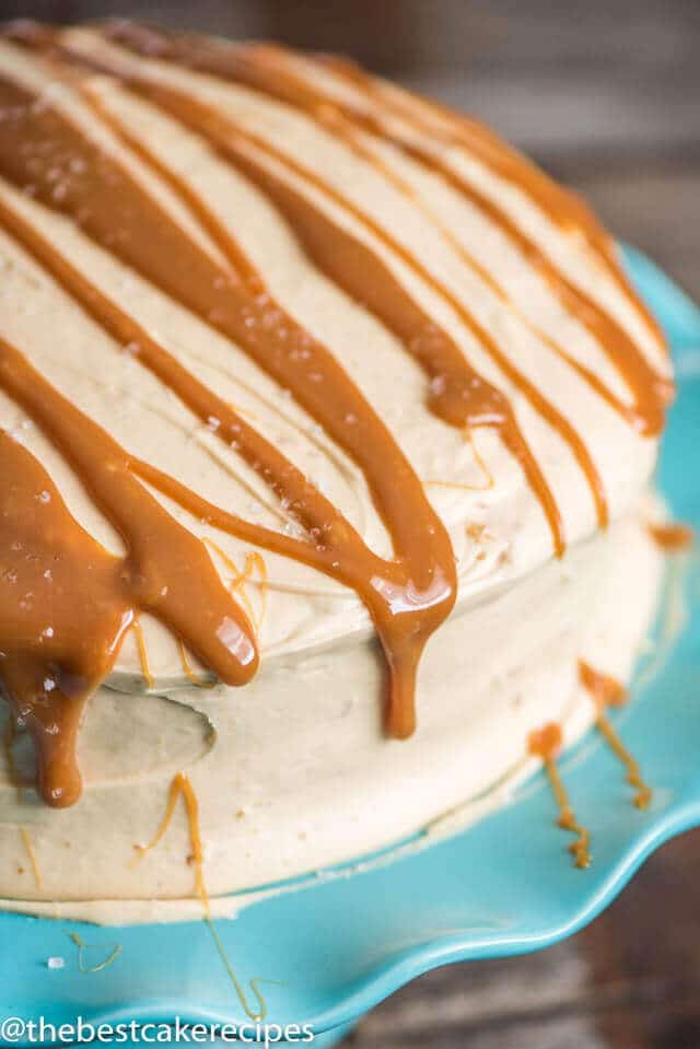 Salted Caramel Cake topped with caramel frosting drizzled with caramel