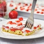 A cake on a plate, with Strawberries