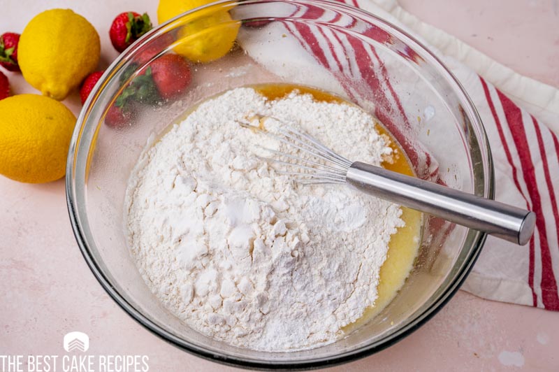 flour over wet ingredients in a bowl