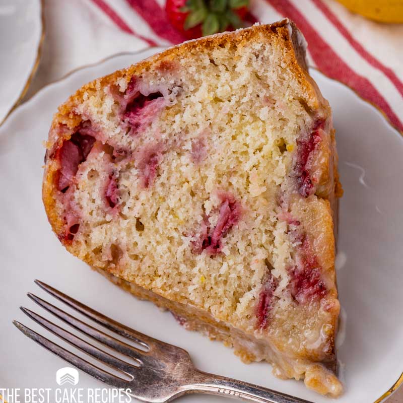 a piece of strawberry cake on a plate