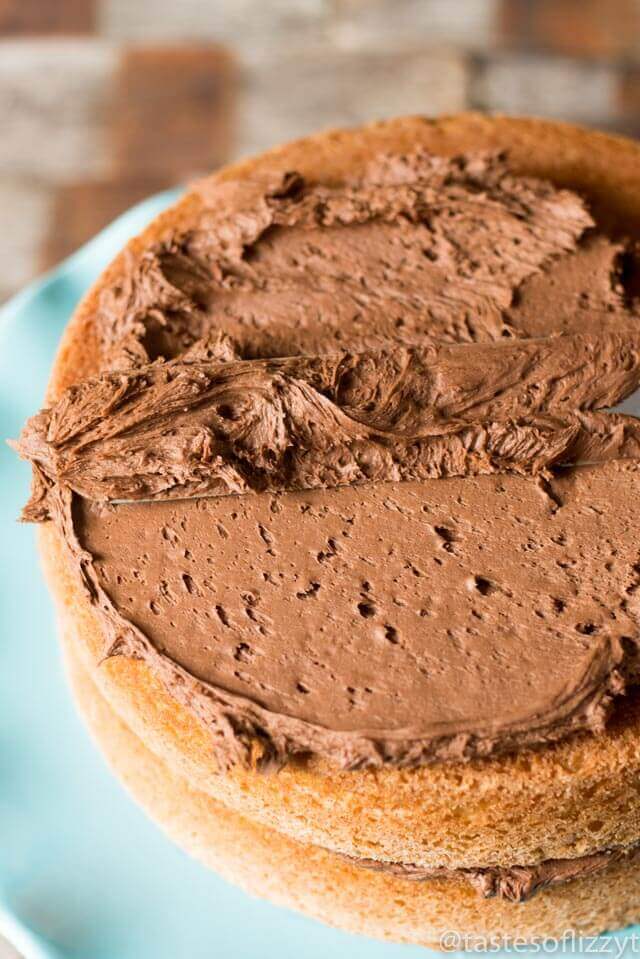 chocolate frosting spreading on a cake