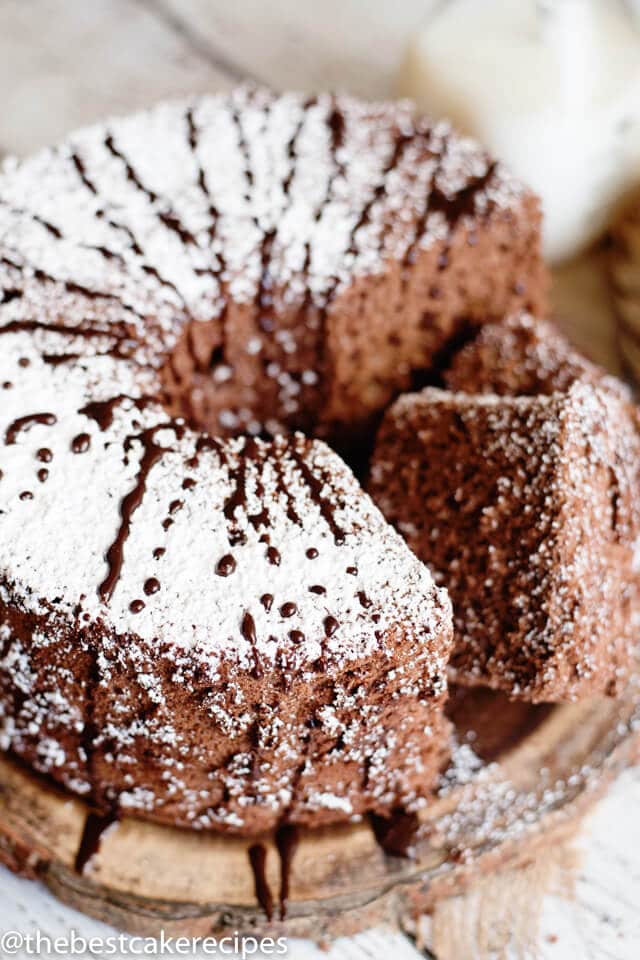 chocolate angel food cake with two slices cut