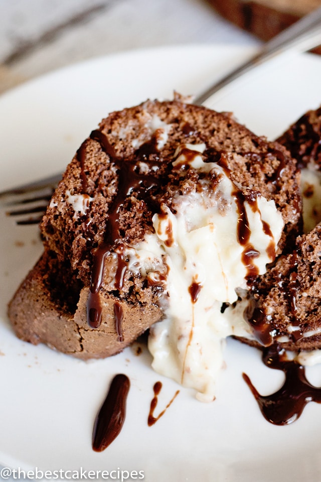 a piece of chocolate cake with pudding filling on a plate