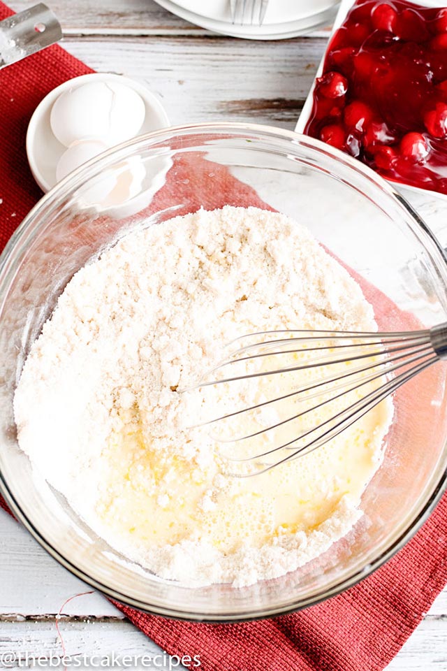flour in a mixing bowl with a whisk