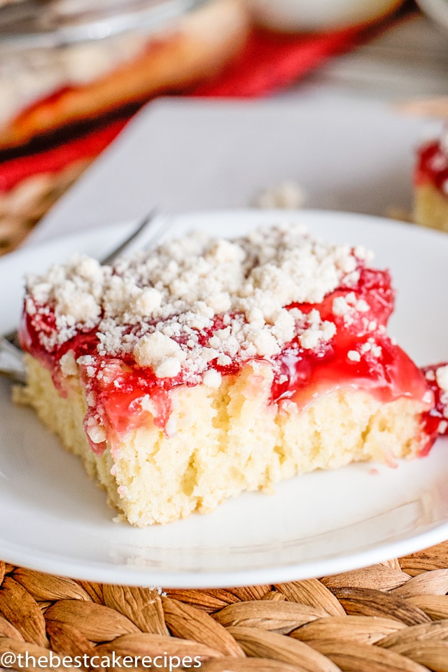 Cherry Coffee Cake - Homemade cake batter uses cherry pie filling for a quick and easy Cherry Coffee Cake that makes a delicious breakfast or dessert. Save part of the crust mixture to sprinkle on top for a yummy sugar streusel.