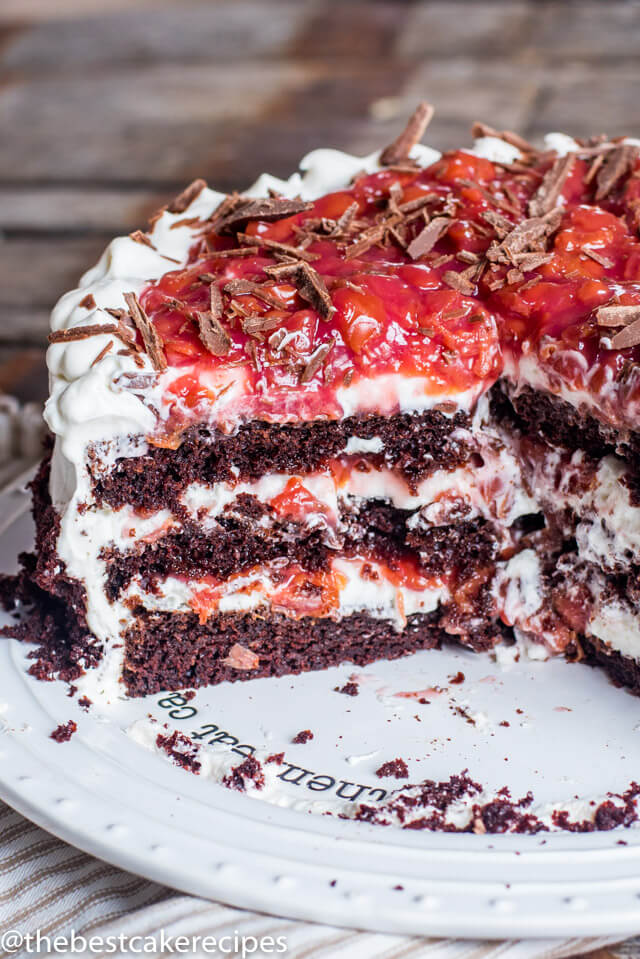 A close up of half of a black forest cake