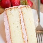 easy white cake with strawberry buttercream on a plate with a fork