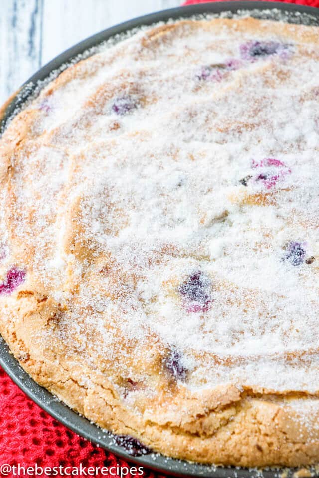 sugar topped berry cake in a baking pan