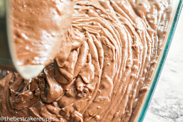 A close up of chocolate cake batter in a pan