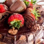 chocolate covered strawberries on a cake