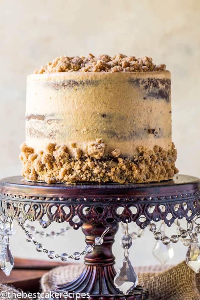 chocolate pumpkin cake with pumpkin spice streusel on a cake stand