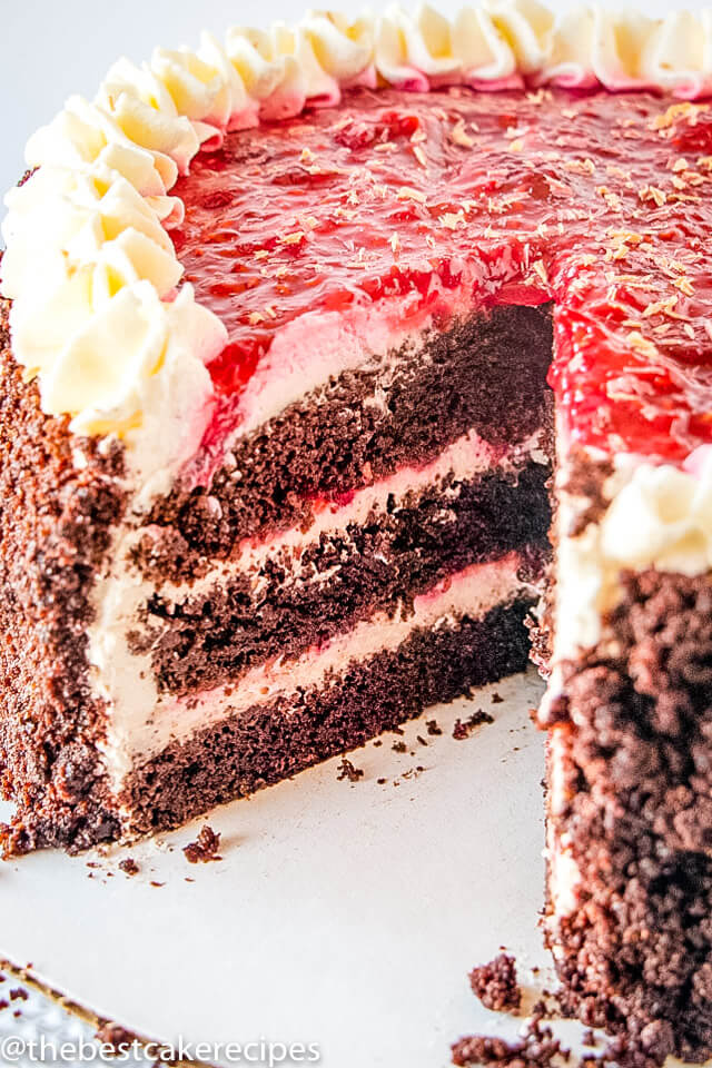 chocolate cake with raspberry filling with one slice missing