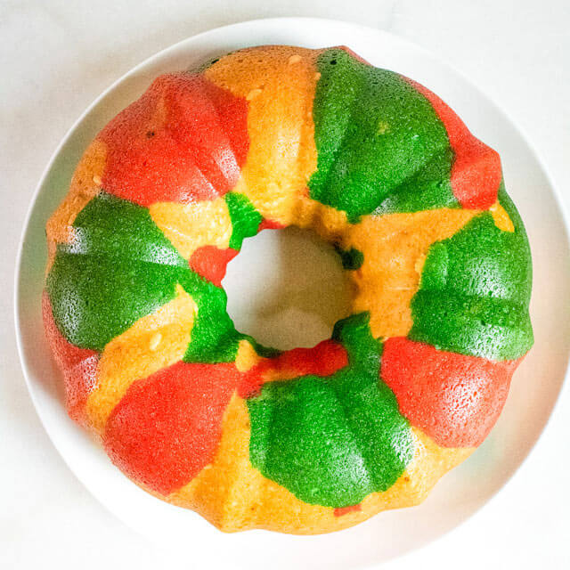 red and green bundt cake  on a cake plate