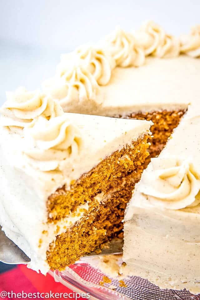 molasses spice layer cake with buttercream frosting with one slice cut