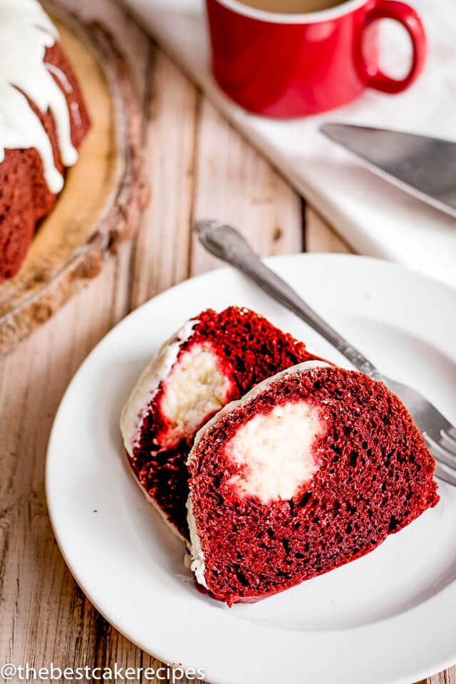 two slices of cream cheese red velvet cake on plate