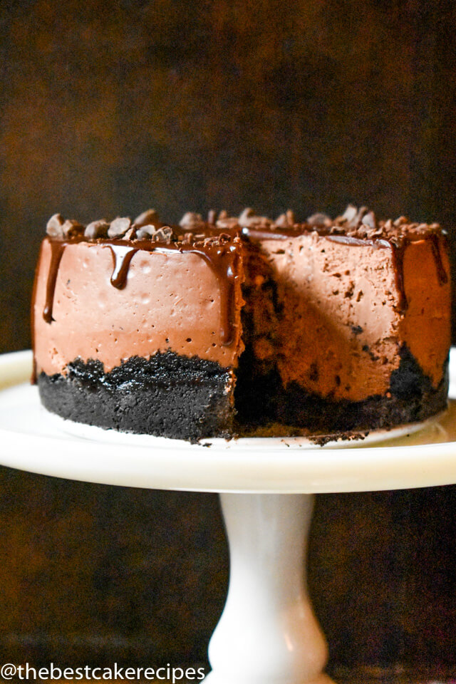 chocolate cheesecake with oreo crust on a cake plate