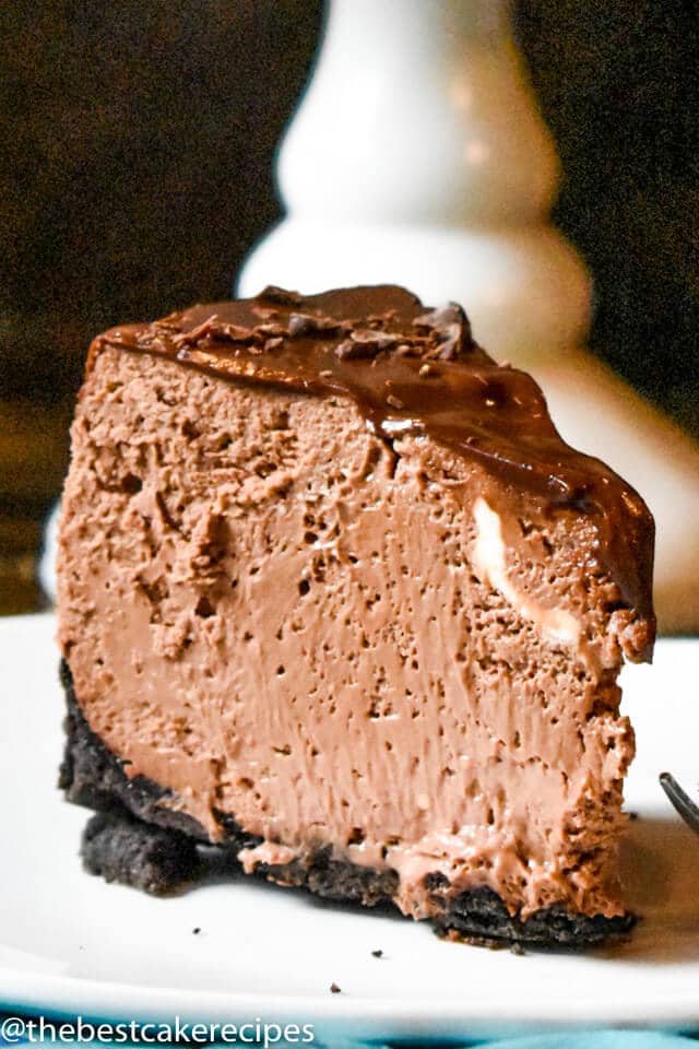 chocolate cheesecake with chocolate ganache on a plate