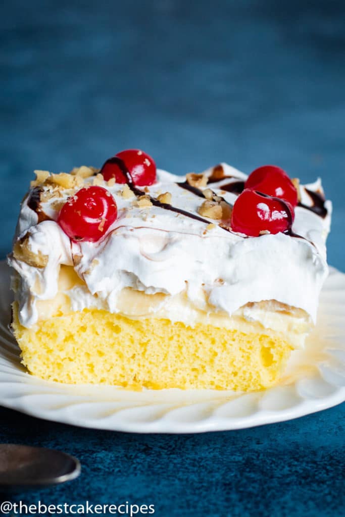 Banana Split Cake Recipe with cherries on a plate