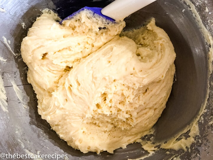 cake batter in a bowl with a rubber spatula