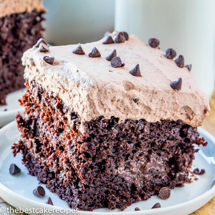 Chocolate Tres Leches Cake with chocolate whipped cream on a plate