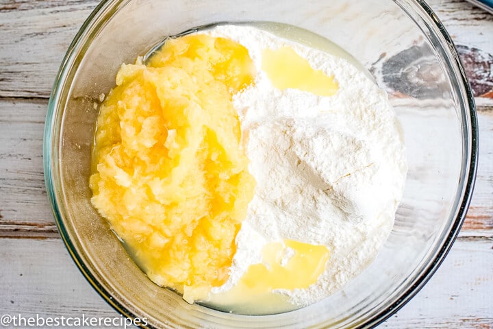 cake mix and pineapple in a mixing bowl