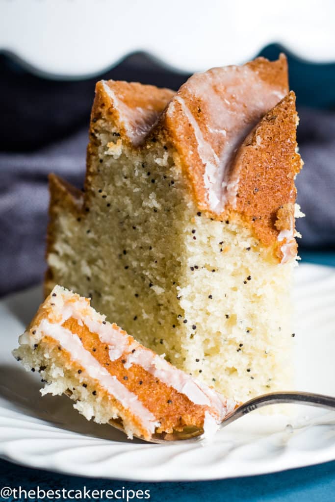Poppy Seed Bundt Cake on a plate with a bite on a fork