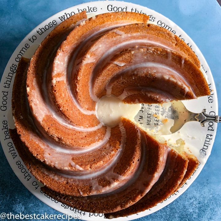 overhead swirled bundt cake with one piece missing