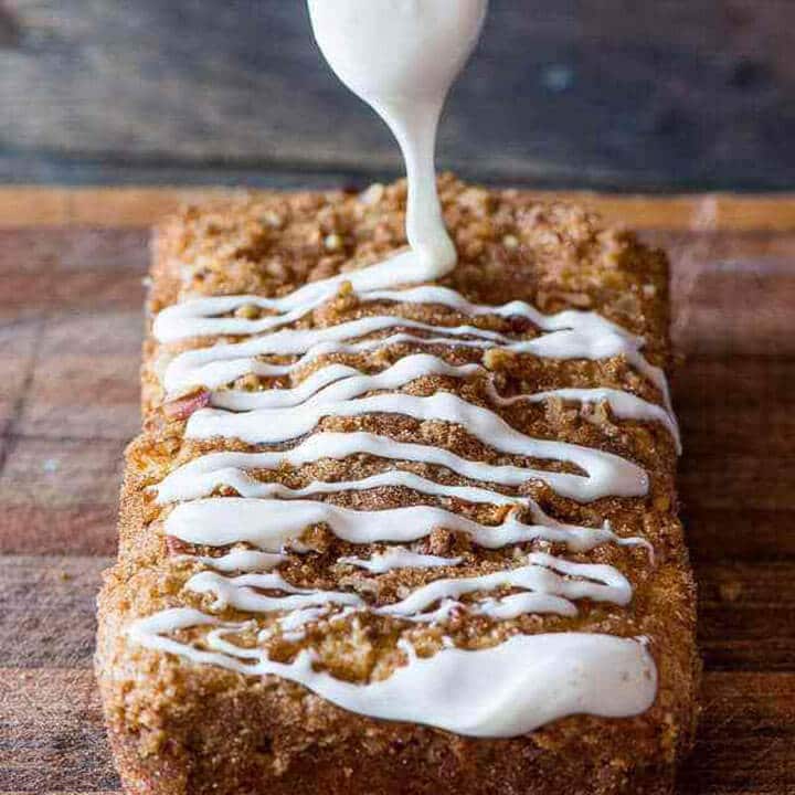 powdered sugar glaze drizzling over a loaf cake