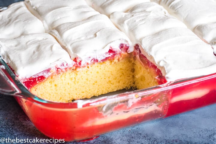 Strawberry Pudding Cake in 9x13 baking pan with two slices missing