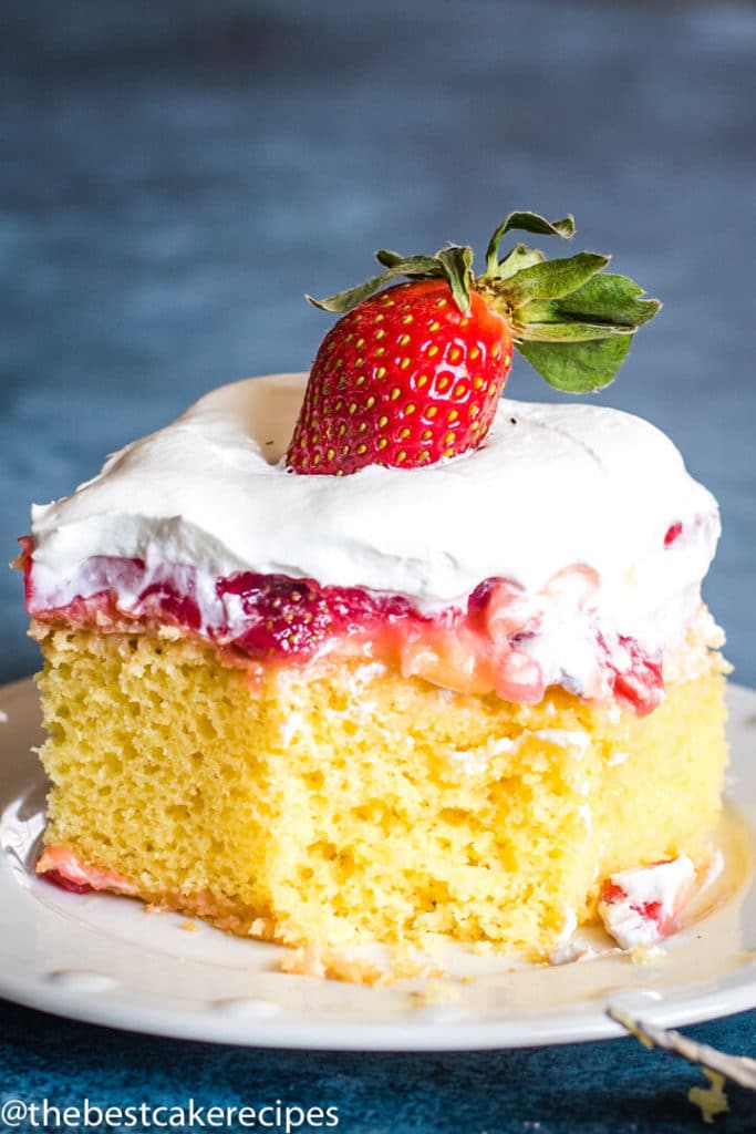 Strawberry Pudding Cake with pudding and strawberries on a plate