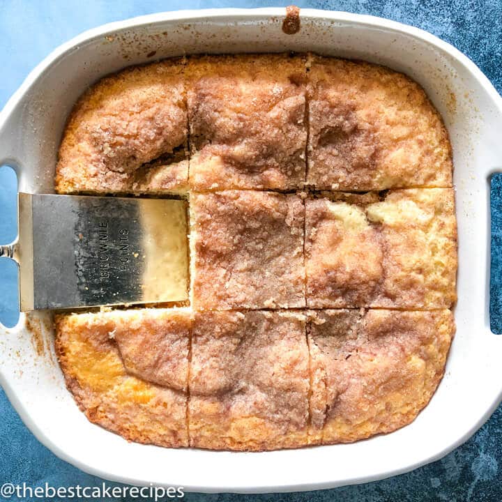 Easy Coffee Cake in baking pan cut with piece missing