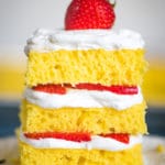 stack of 4 Ingredient Lemon Cake with whipped cream and frosting