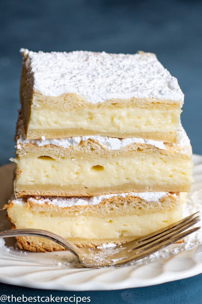 stack of 3 crescent roll breakfast cheesecake pieces on a plate