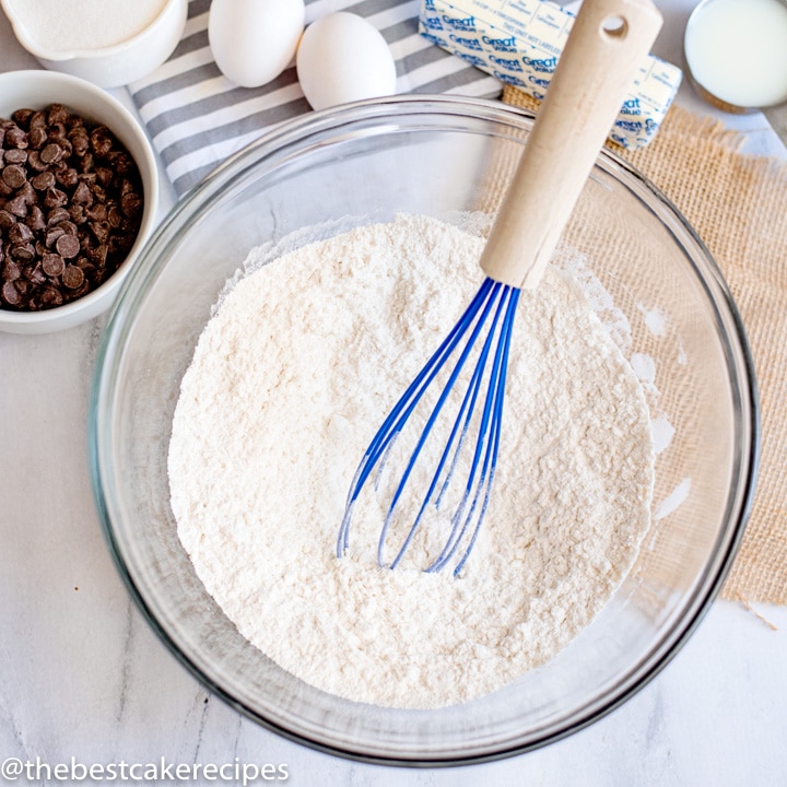 bowl of flour with whisk