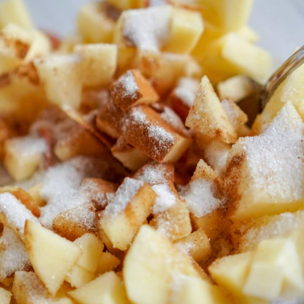 apples with cinnamon and sugar in a bowl