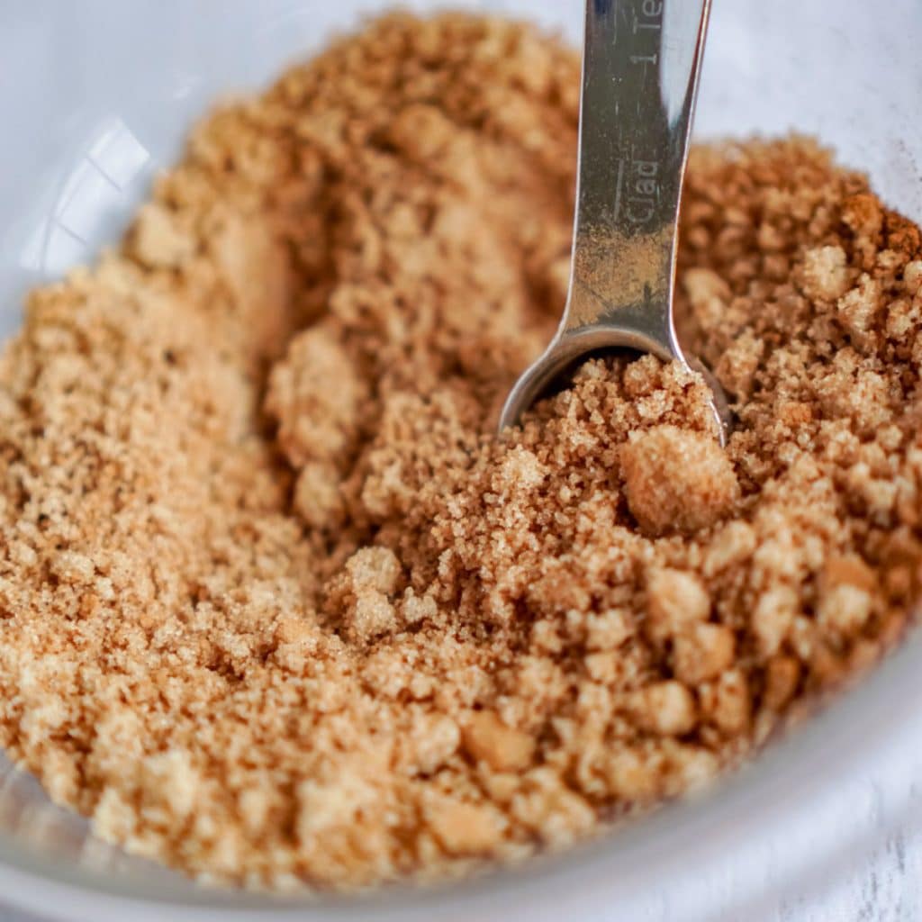 sugar and cinnamon in a bowl with measuring spoon