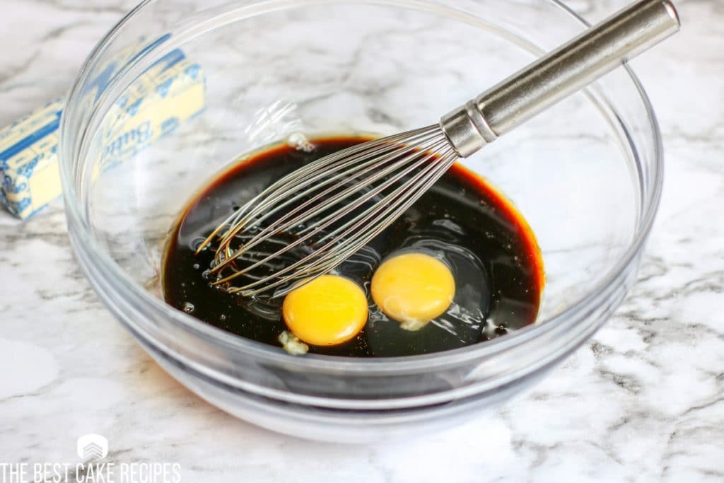 sugar, molasses and eggs in a bowl