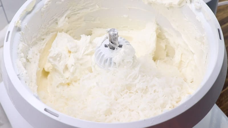 coconut buttercream frosting in a mixer