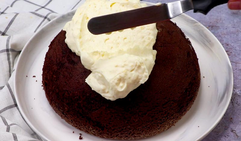 frosting a chocolate snowball cake
