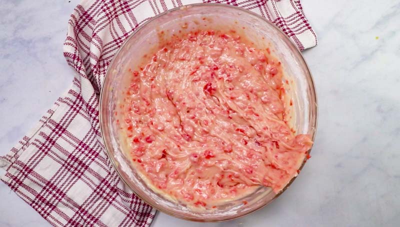 cherry cake batter in a mixing bowl