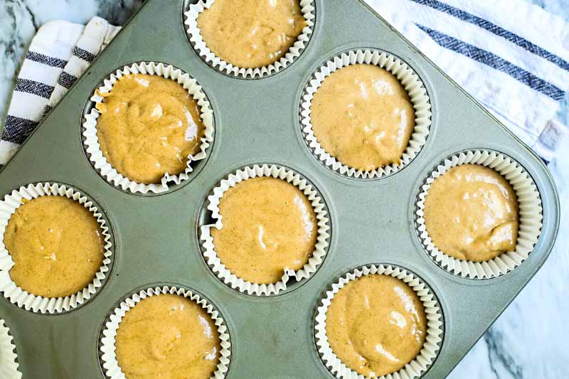 unbaked spice cupcakes in muffin tin