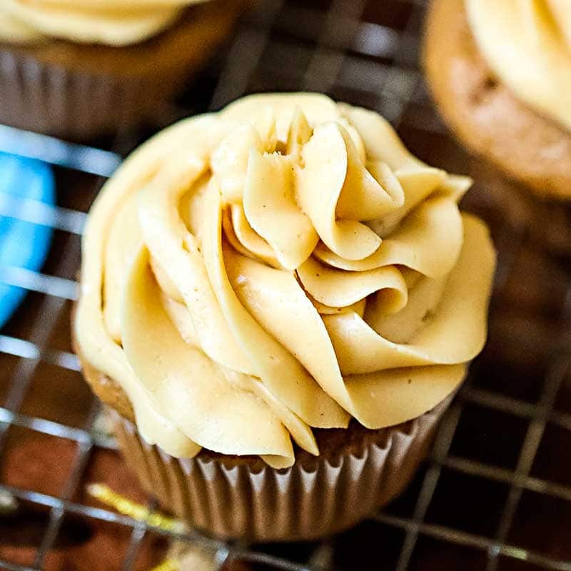 caramel frosting piled on a cupcake