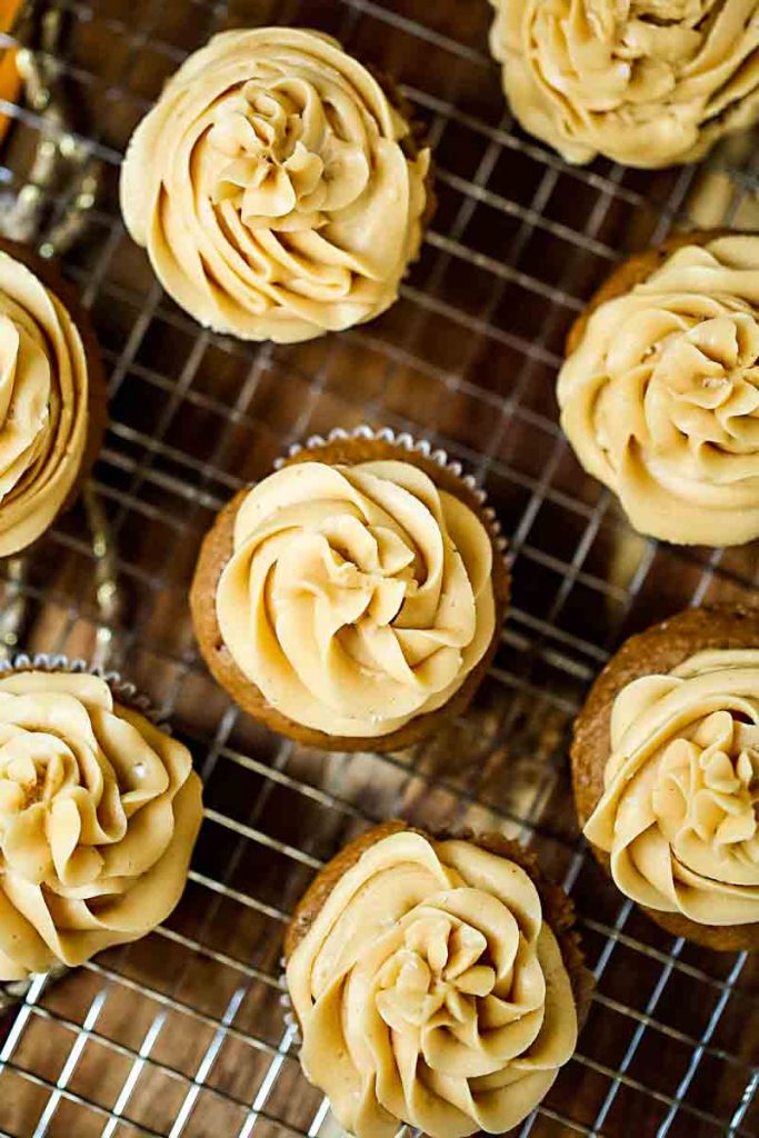 Easy Spice Cupcakes with caramel buttercream on a wire rack