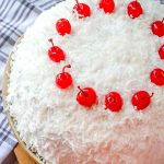 snowball cake with coconut and cherries
