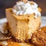 bite out of creamy pumpkin cheesecake
