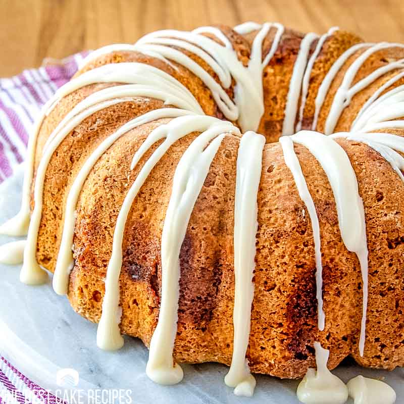 drizzled Jewish Apple Cake on a cake plate