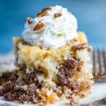 Pecan Pie Cake Recipe with chopped pecans on a plate
