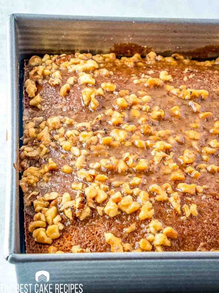 baked walnut date cake in a pan