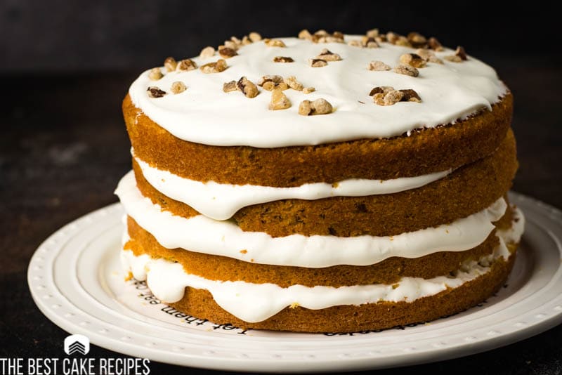 4 layer yellow cake with white frosting and walnuts